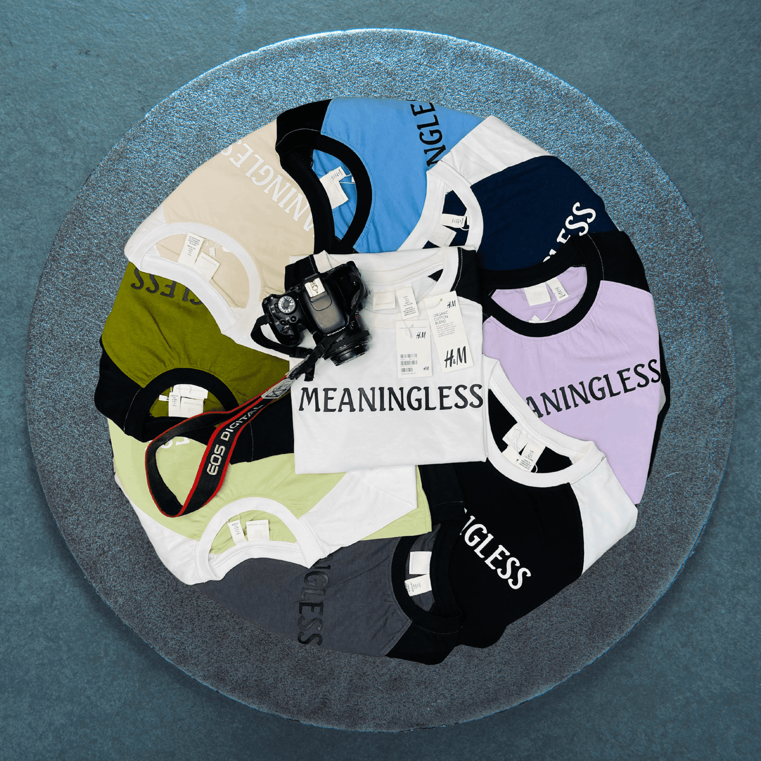 All meaningless raglan drop shoulder t-shirt from teehub is decorated on a round table