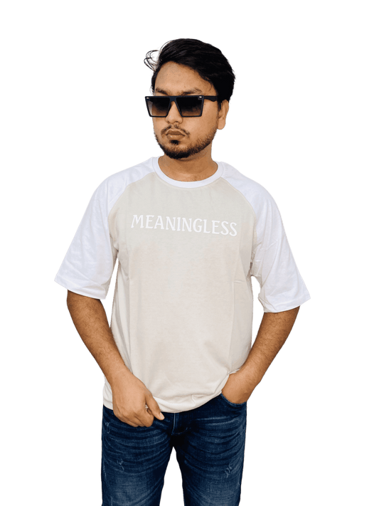 Cream 'MEANINGLESS' raglan tee on model - neutral oversized streetwear with contrast sleeves