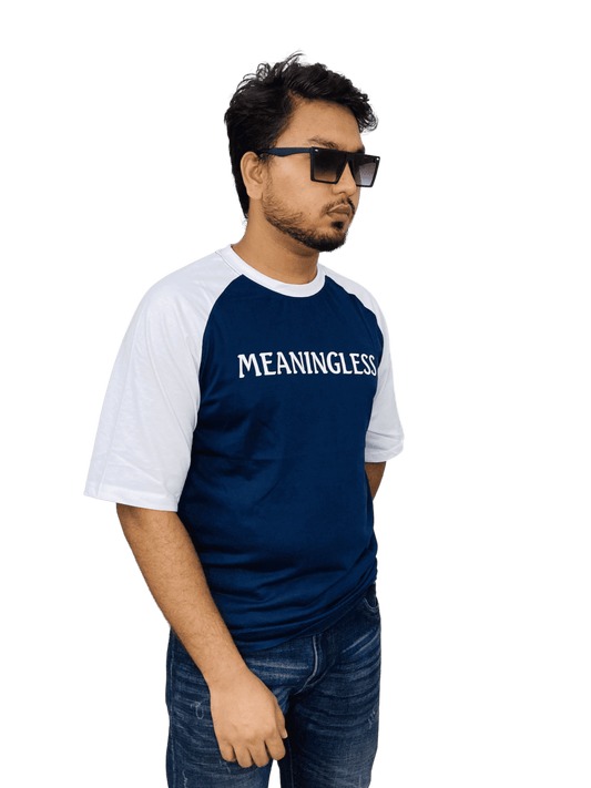 Navy 'MEANINGLESS' raglan tee on model - classic oversized streetwear with contrast sleeves